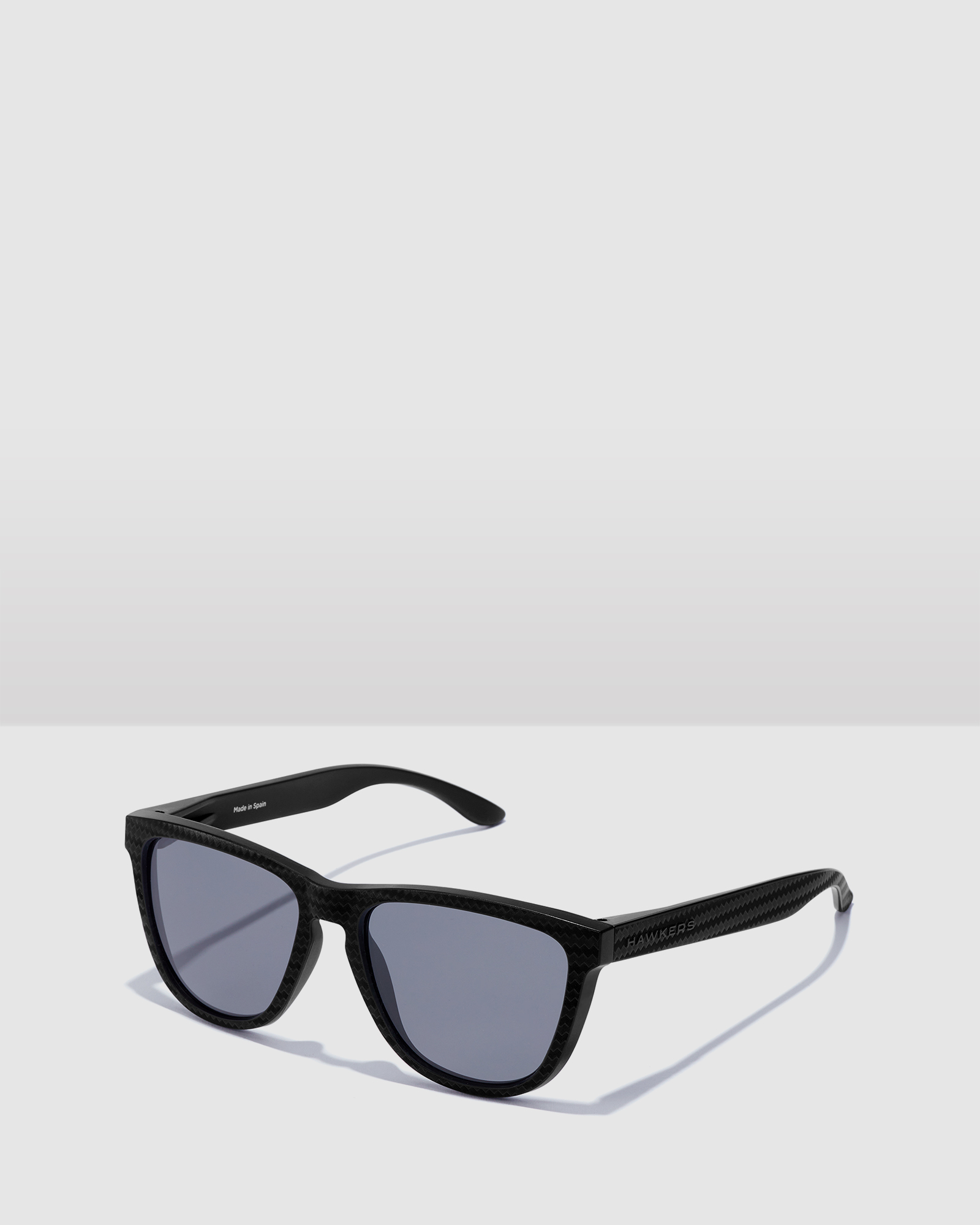 HAWKERS Polarized Dark Carbon One Raw Sunglasses for Men and Women UV400