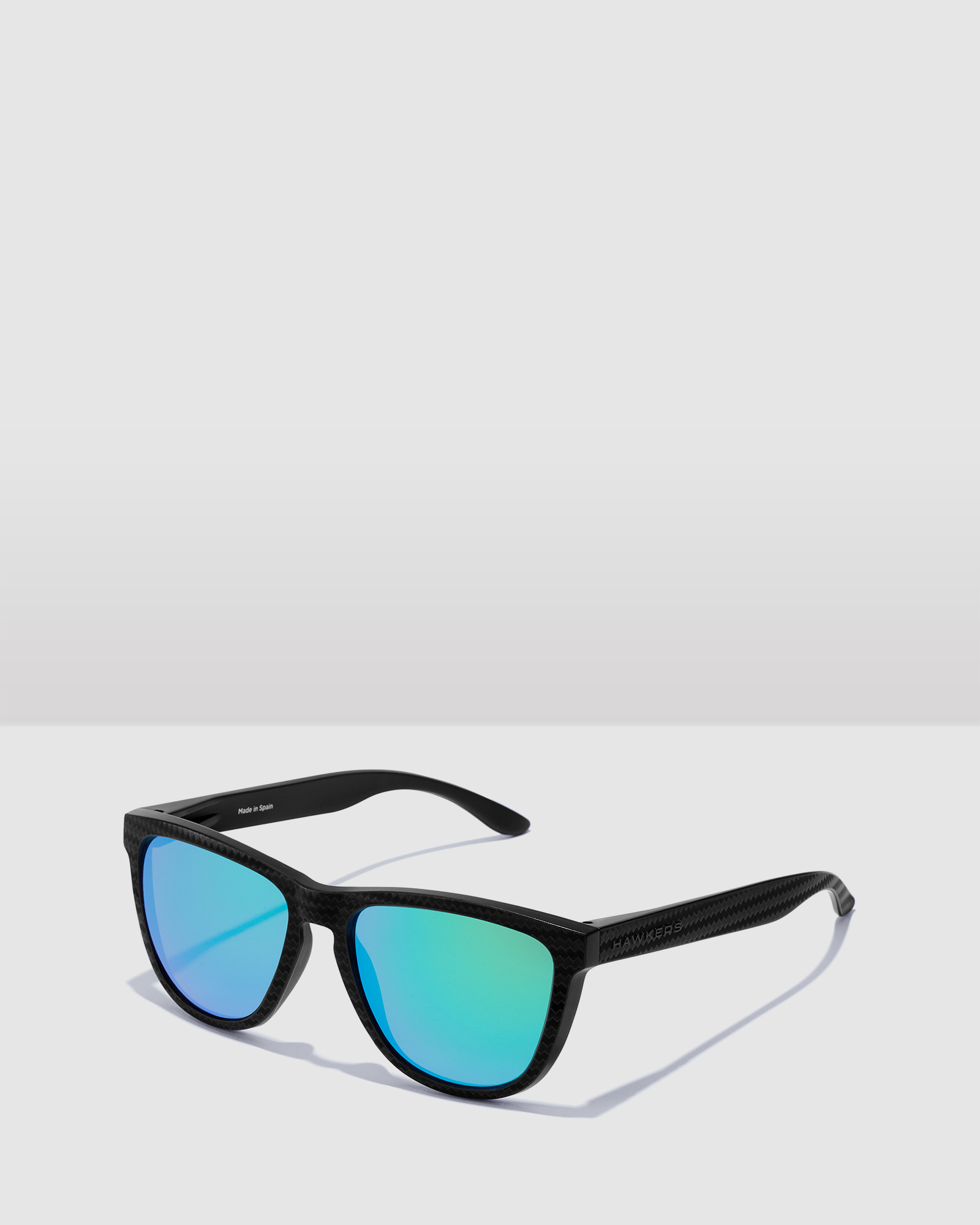 HAWKERS Polarized Black Green One Raw Sunglasses for Men and Women UV400