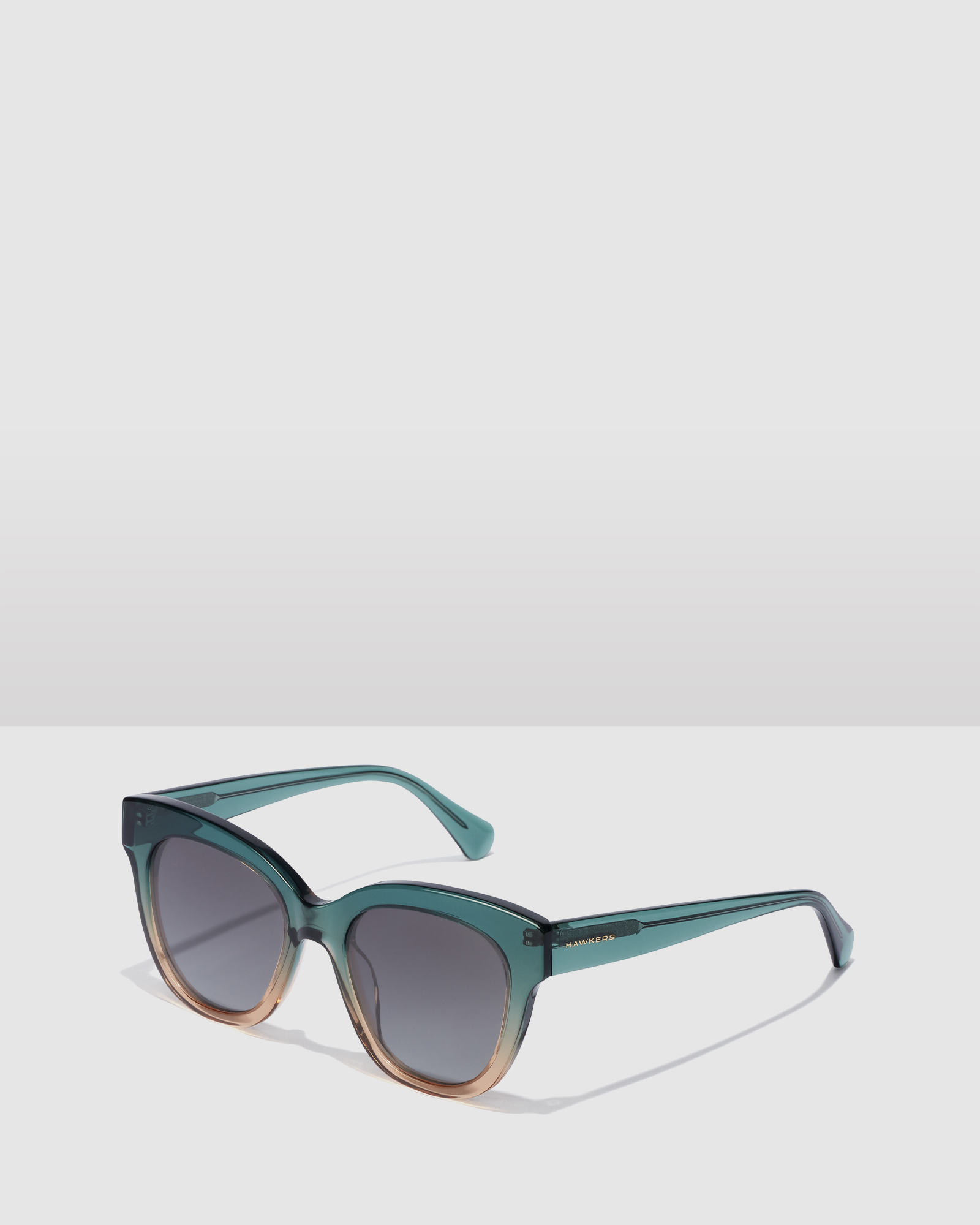 HAWKERS - Green Champagne AUDREY Sunglasses for Men and Women UV400