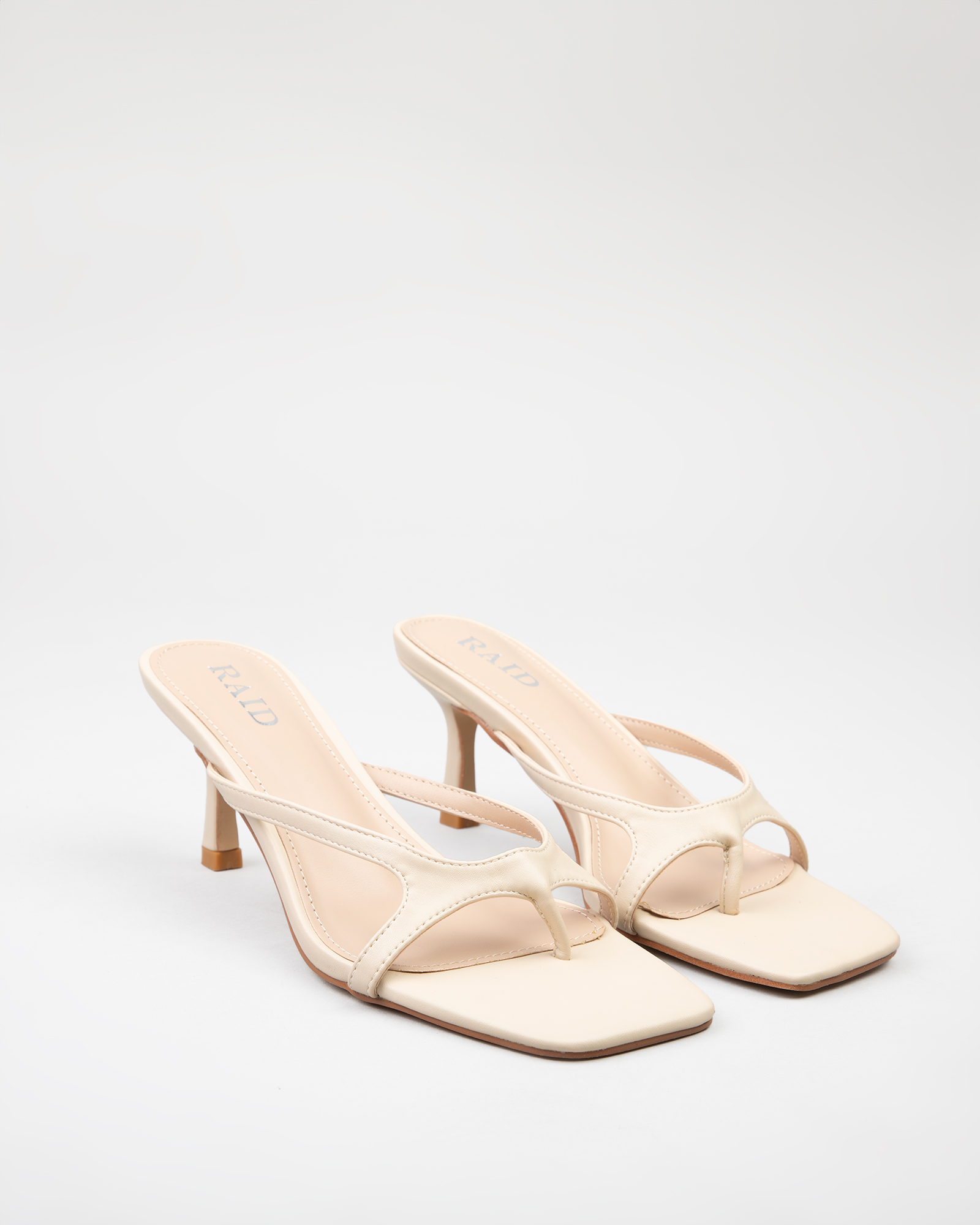 Briar kitten heeled mules in Off White